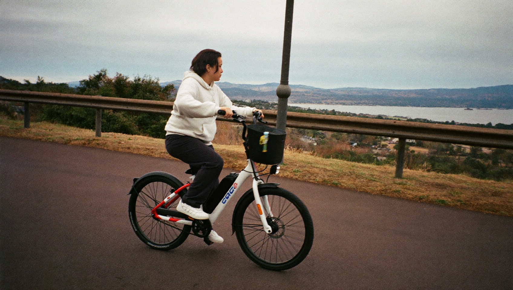 Rider on a Class 3 e-bike on the paved Burke-Gilman Trail in Seattle, Washington