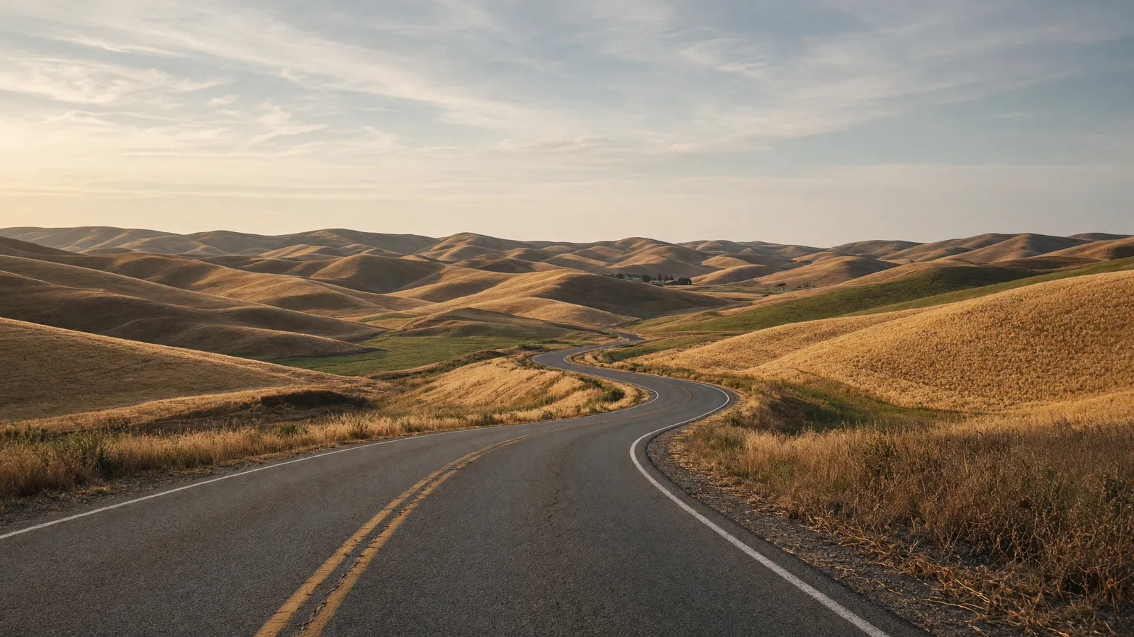 Empty Palouse rolling wheat hills and two-lane toward Moscow, Latah County, Idaho
