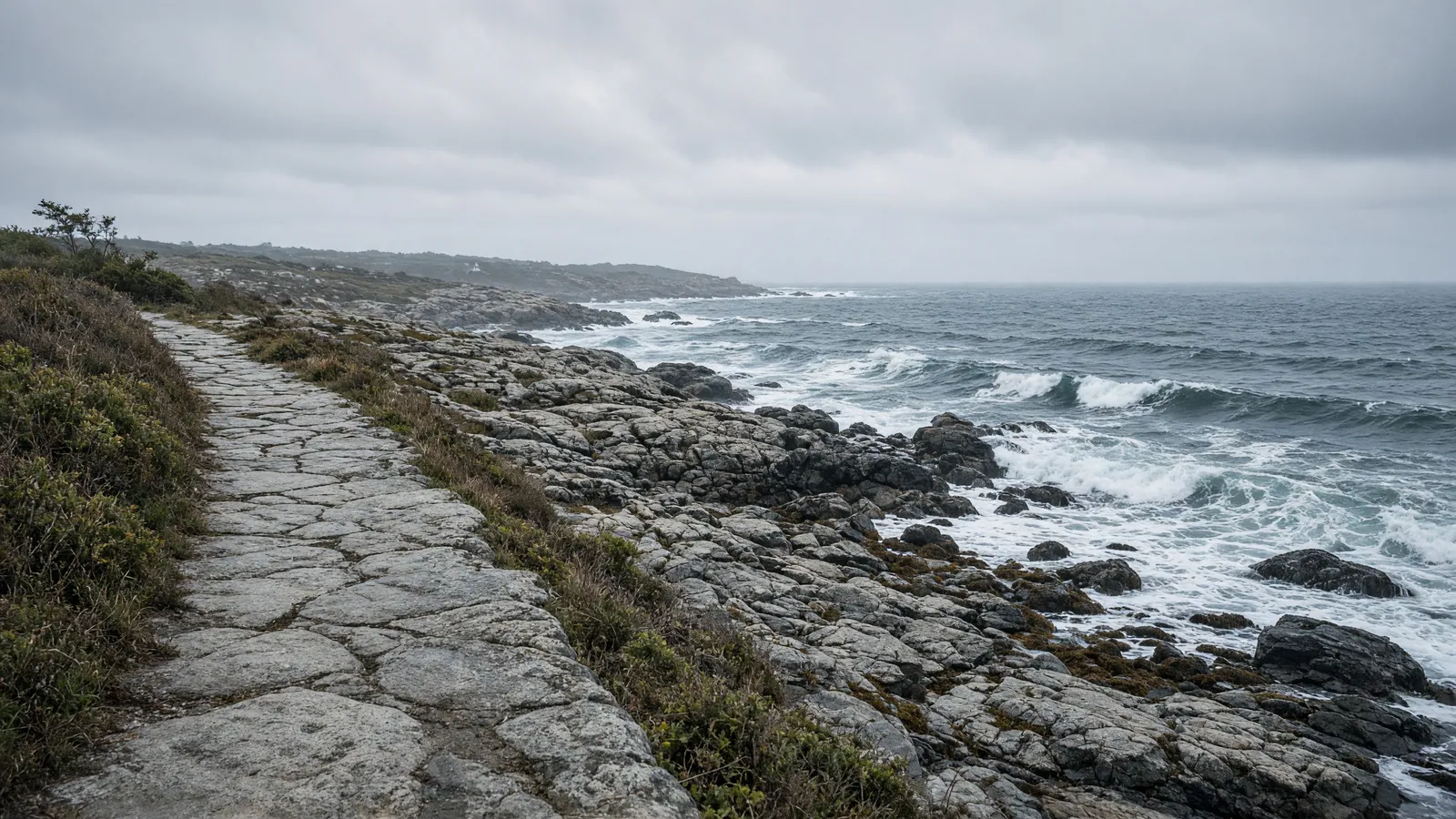 Empty granite coastal path along Cape Ann rocky shoreline near Gloucester, Essex County, Massachusetts