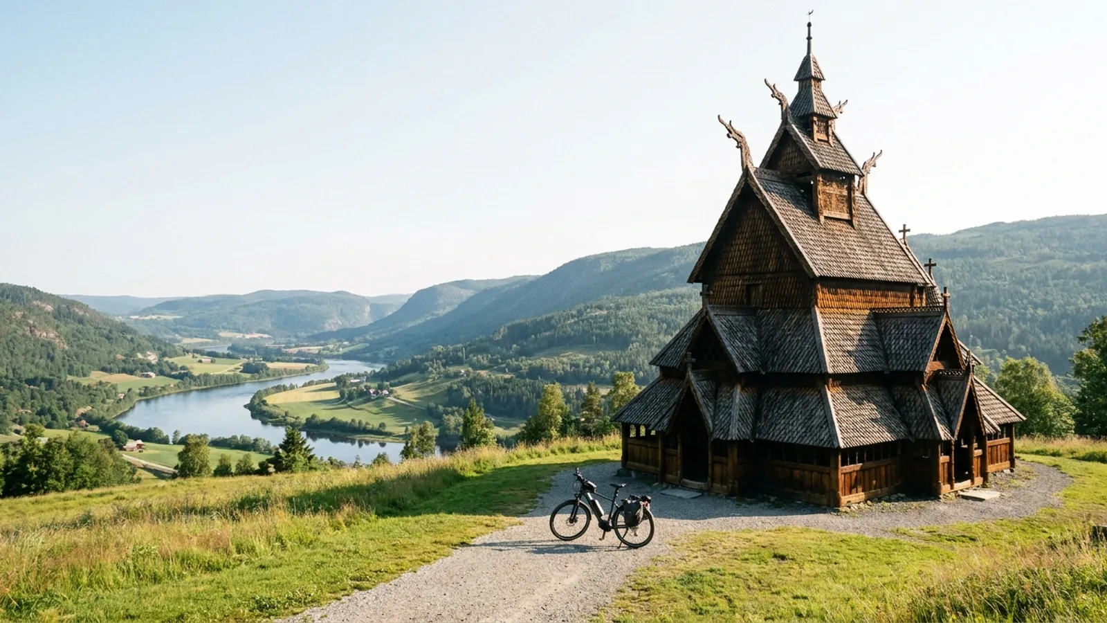 Electric bike on a path beside a small Scandinavian timber stave church with steep dark shingled roofs and carved dragon heads on a grassy hillside