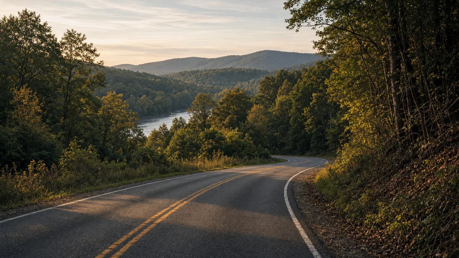 Empty Delaware River valley two-lane through woods toward Jenny Jump ridges, Warren County, New Jersey