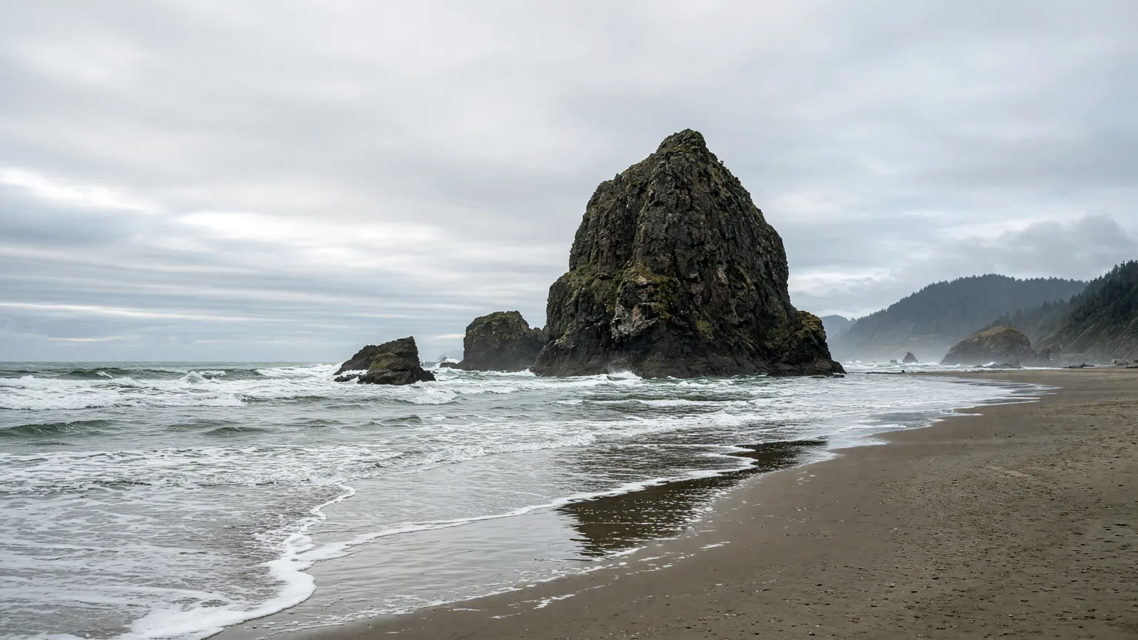 Cannon Beach Haystack Rock and Pacific surf, Oregon