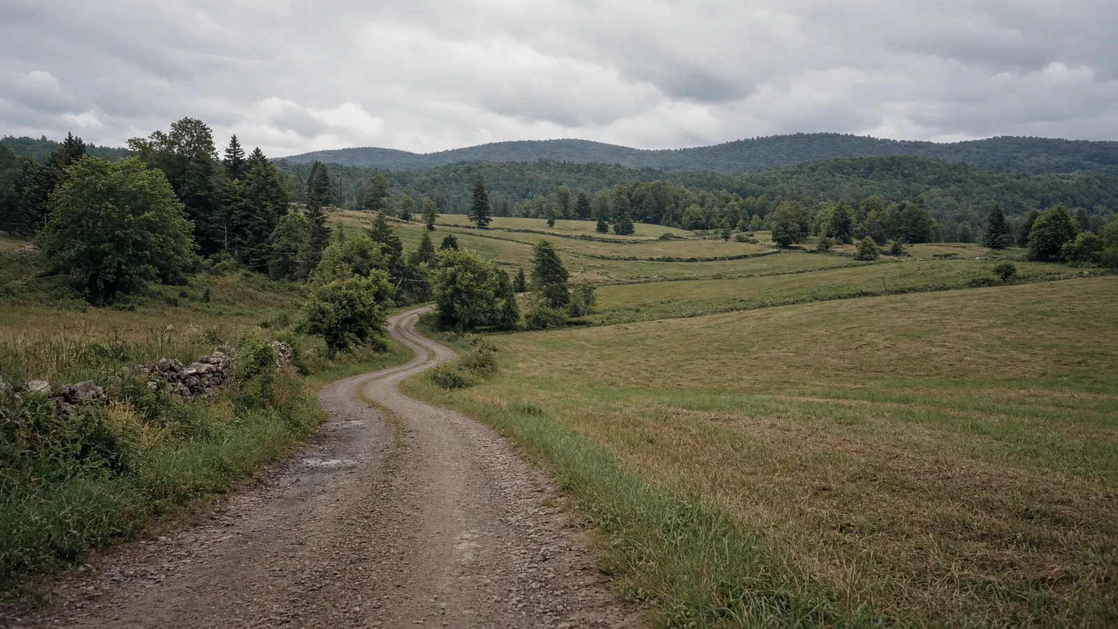 Empty mixed-surface valley corridor and farmland in Orange County, Vermont