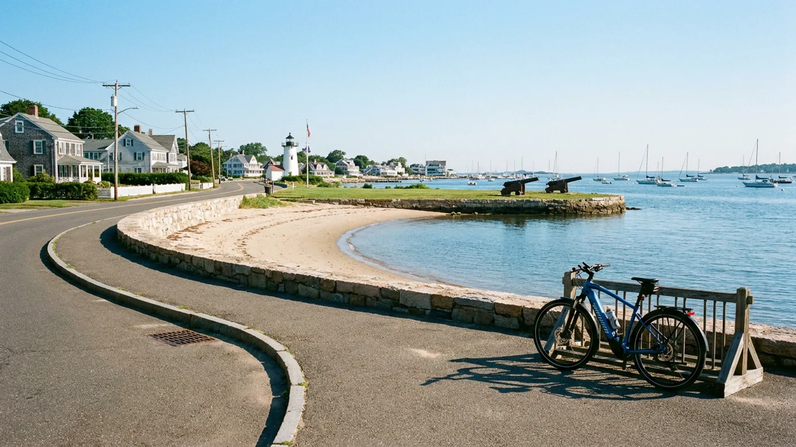 Electric bike parked beside the seawall at a Long Island Sound town beach in Westport Connecticut