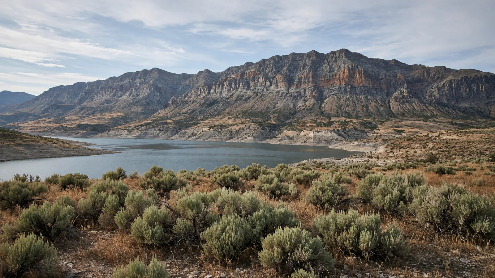 Empty high-desert bench and Absaroka wall light near Cody in Park County, Wyoming